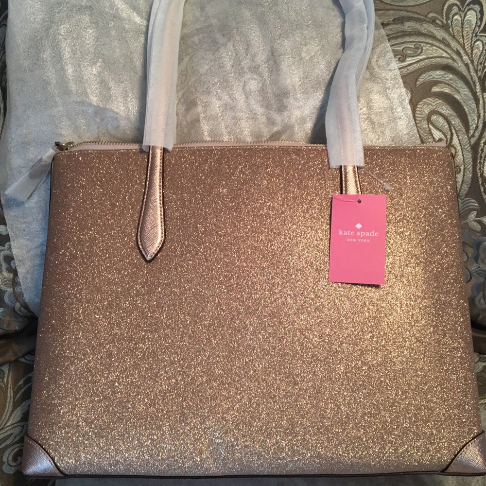 Kate Spade rose gold tote. Never used. Still has packaging and in plastic